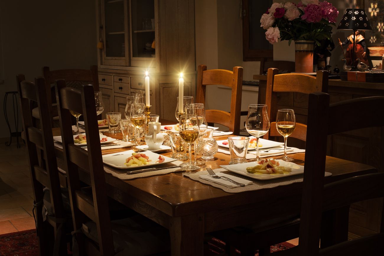 Candlelit restaurant table set for an evening meal