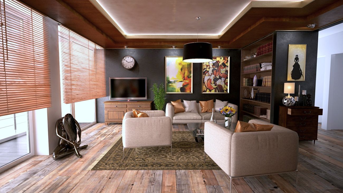 Spacious sitting area with sofas, timber finishes and large windows